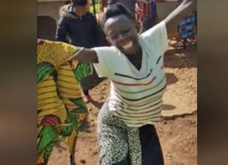 Mulher africana dança de alegria e gratidão ao ganhar primeiro par de sapatos