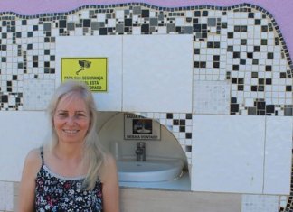 Advogada constrói bebedouro no muro da própria casa para moradores de rua