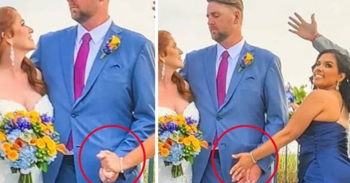 Madrinha com ‘mão-boba’ em foto de casamento viraliza e noivos se explicam